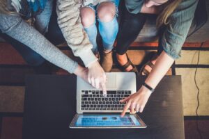 Women pointing to Laptop